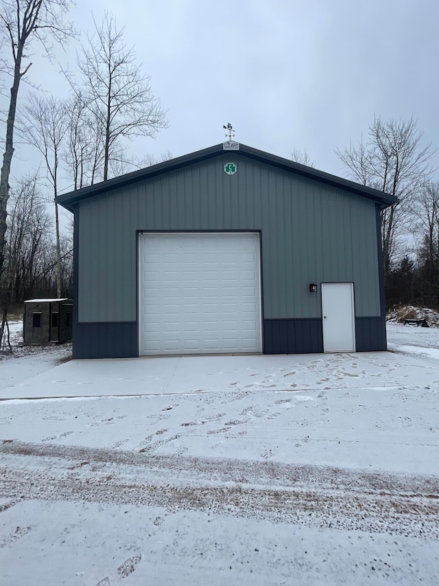 view of snow covered garage