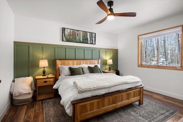 bedroom featuring ceiling fan and dark hardwood / wood-style floors