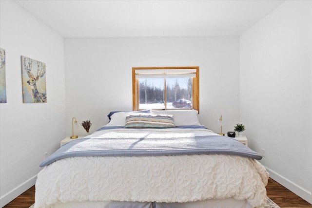 bedroom featuring dark hardwood / wood-style floors