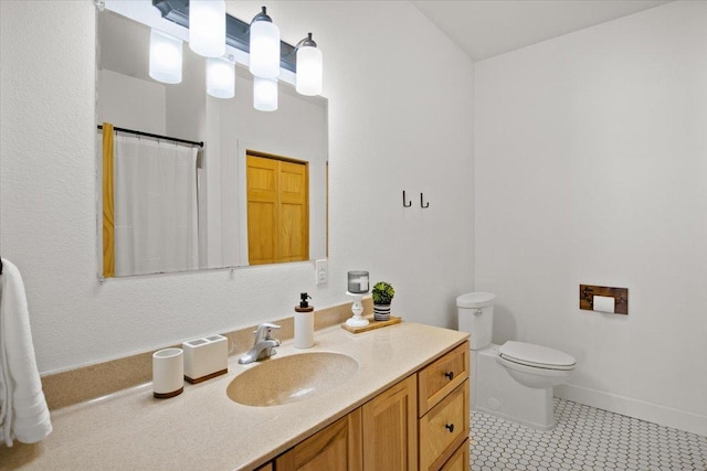 bathroom with curtained shower, toilet, vanity, and tile patterned flooring