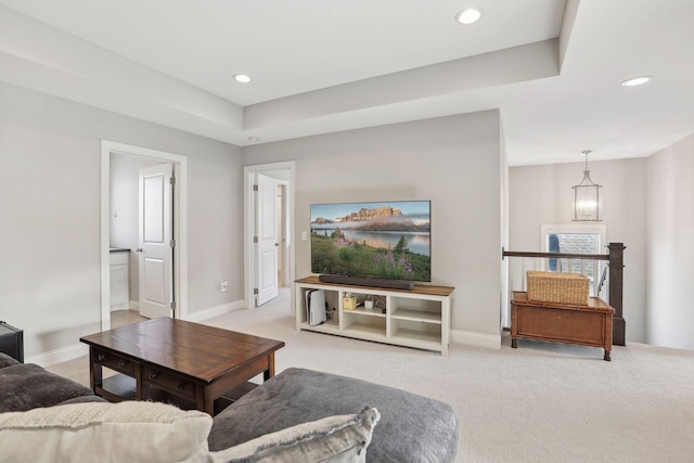 living room featuring light carpet and recessed lighting