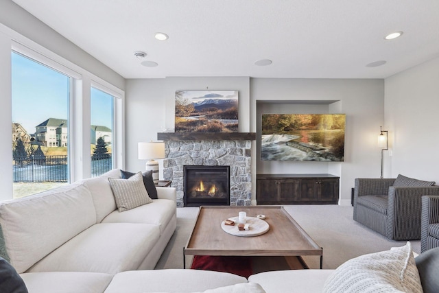 carpeted living room featuring a fireplace and recessed lighting