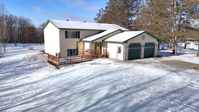 view of front of house featuring a garage and a deck