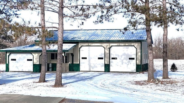 view of snow covered garage