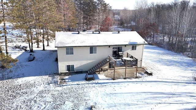 view of snow covered house