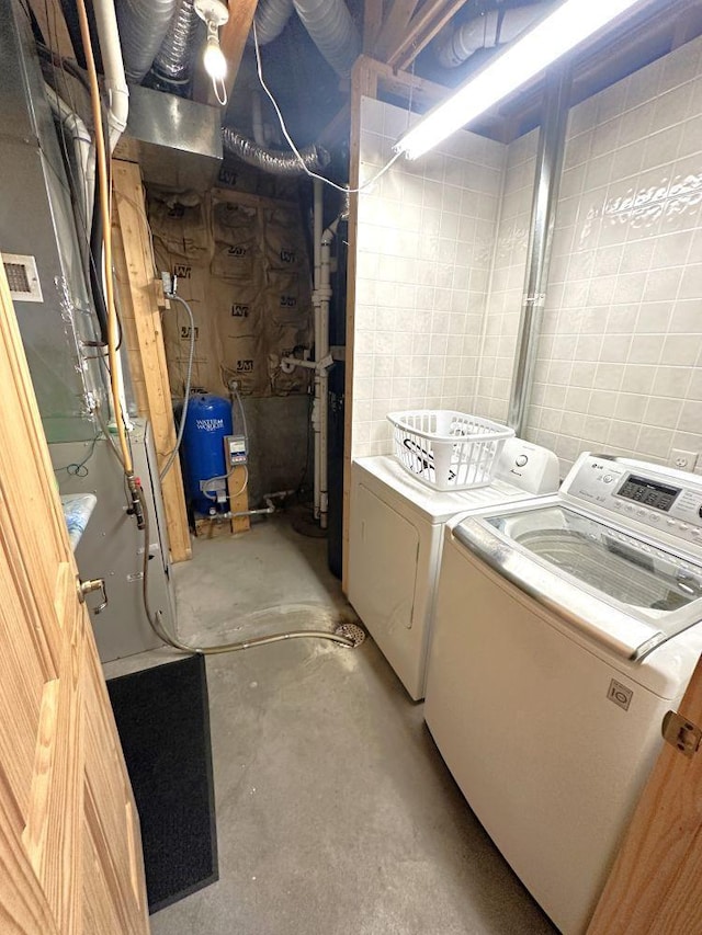 washroom featuring independent washer and dryer