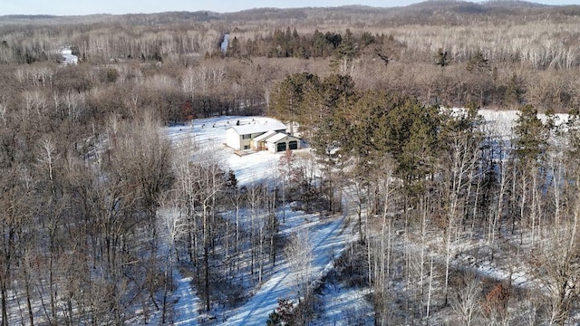 birds eye view of property with a view of trees