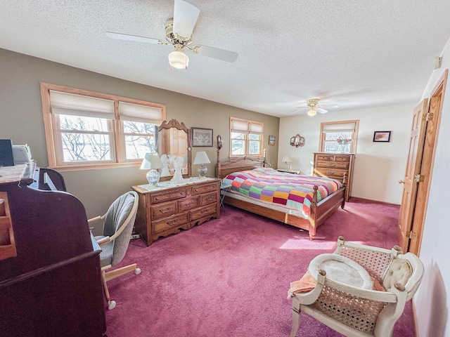 carpeted bedroom with a textured ceiling and ceiling fan