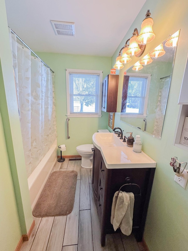 full bathroom featuring vanity, toilet, and shower / bath combo with shower curtain