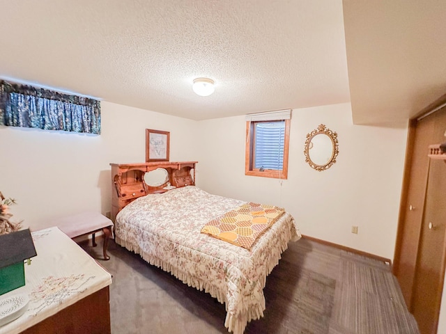 carpeted bedroom with a textured ceiling