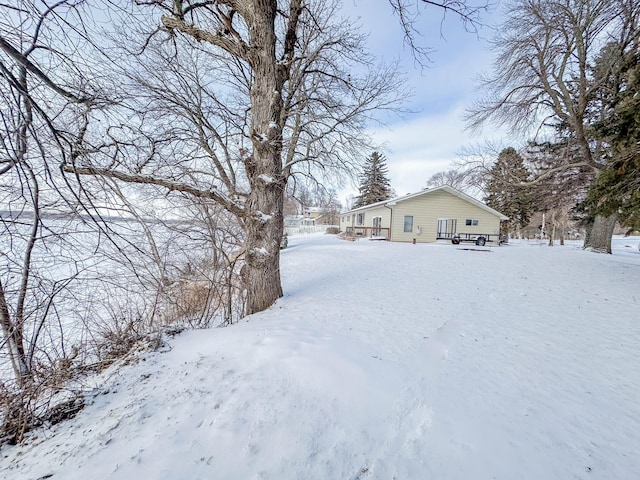 view of yard covered in snow