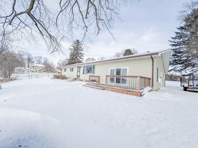 view of snow covered house