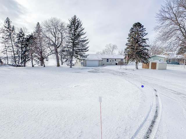 view of front of home featuring a shed