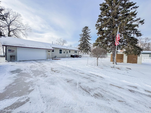 exterior space with fence and a garage