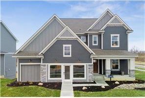 craftsman-style house featuring a front lawn and covered porch