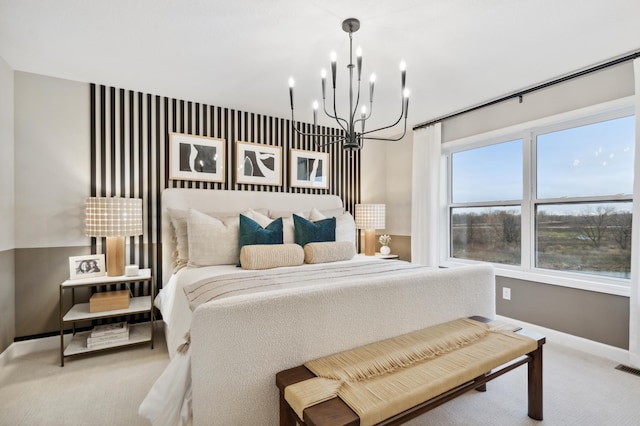 bedroom with carpet floors and a notable chandelier