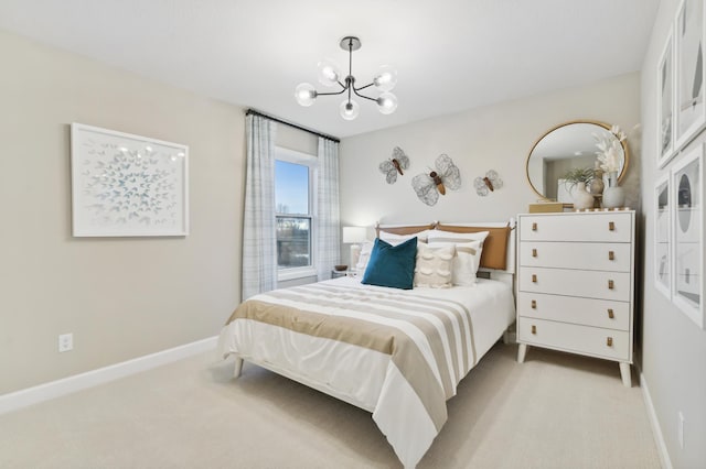 carpeted bedroom featuring a notable chandelier