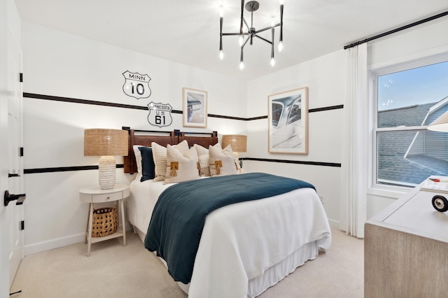 carpeted bedroom featuring a notable chandelier