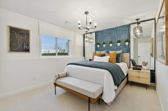 carpeted bedroom with a notable chandelier