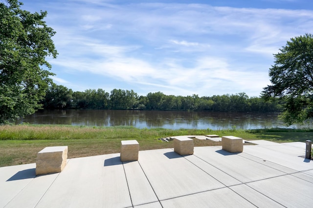 view of patio with a water view