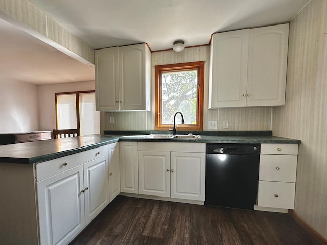 kitchen featuring sink, white cabinetry, dishwasher, and kitchen peninsula