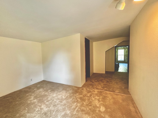 empty room with dark colored carpet