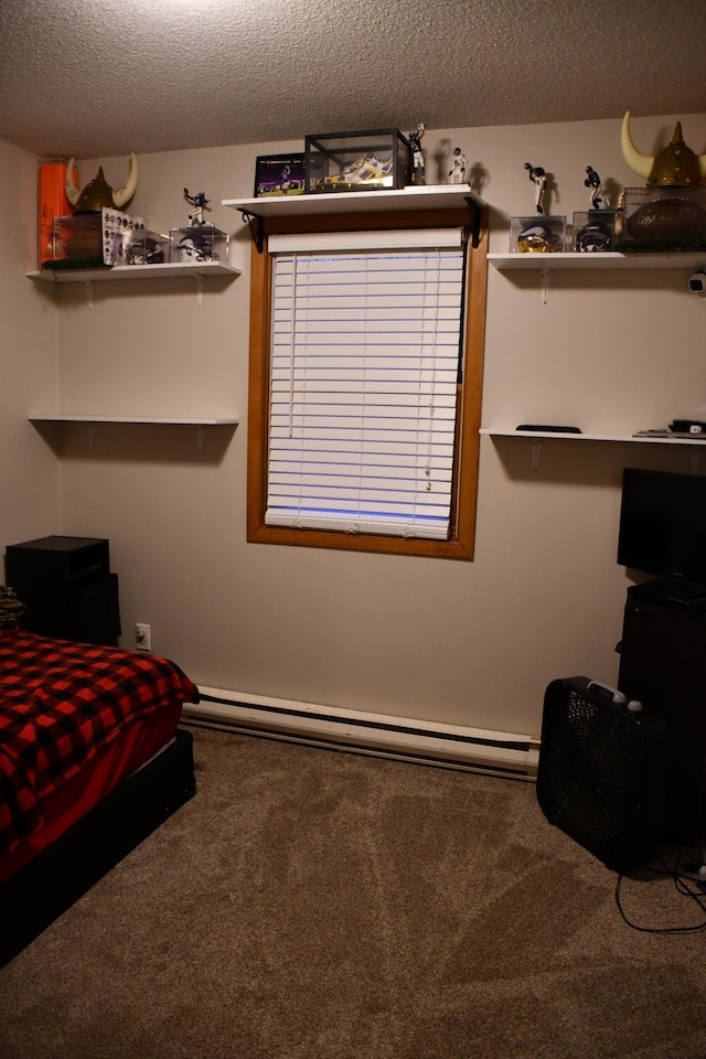 bedroom featuring carpet floors, a textured ceiling, and a baseboard radiator