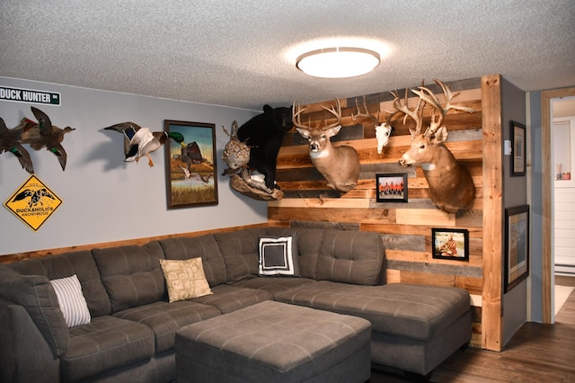 living room with hardwood / wood-style floors and a textured ceiling