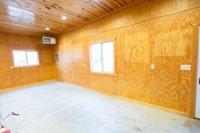 empty room featuring wood walls, wood ceiling, and a wall mounted air conditioner