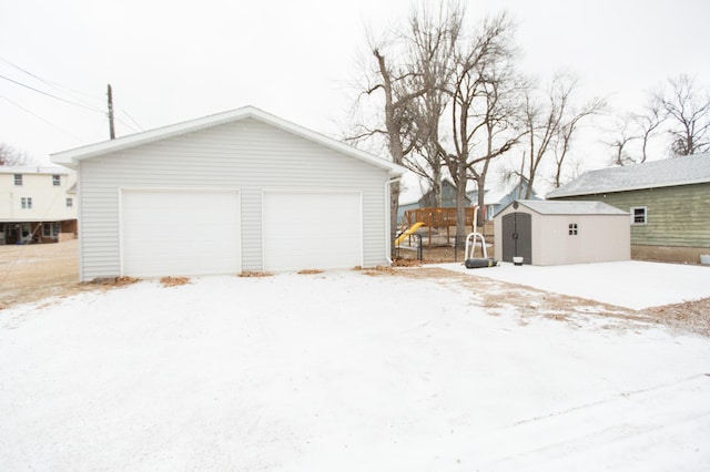 view of snow covered garage