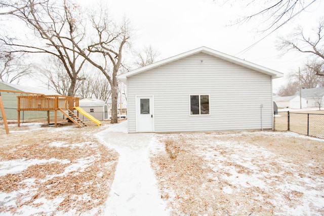 snow covered property featuring a deck