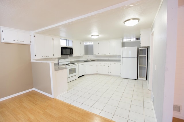 707 Haarfager Ave N, Canby, MN 56220 - kitchen with white appliances, a sink, white cabinets, and light countertops