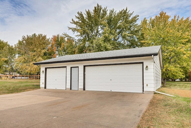 garage with a yard