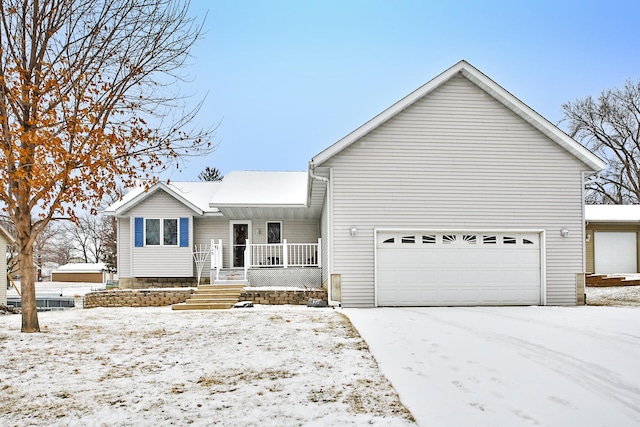 view of front of property featuring a porch and a garage