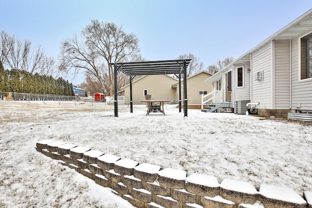 yard layered in snow featuring cooling unit