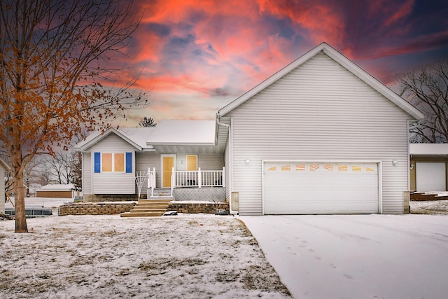 view of front of house with covered porch and a garage