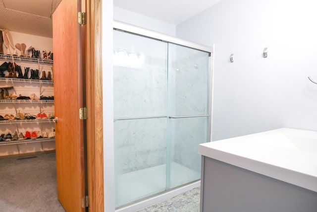 bathroom featuring vanity and walk in shower