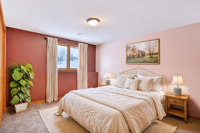 carpeted bedroom with a textured ceiling