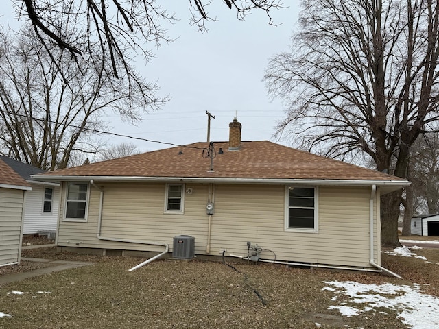 rear view of property featuring central air condition unit