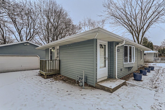 view of front of house featuring a garage and an outdoor structure