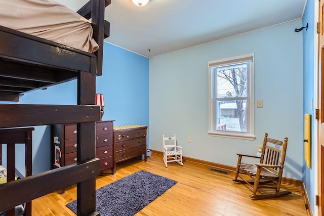 bedroom with light wood-type flooring