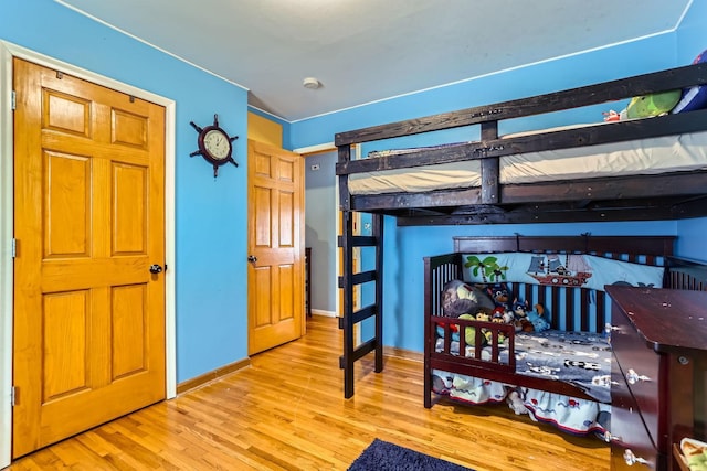 bedroom with light hardwood / wood-style floors