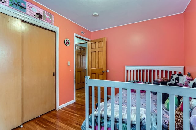 bedroom with wood-type flooring