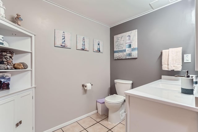 bathroom featuring tile patterned floors, vanity, ornamental molding, and toilet