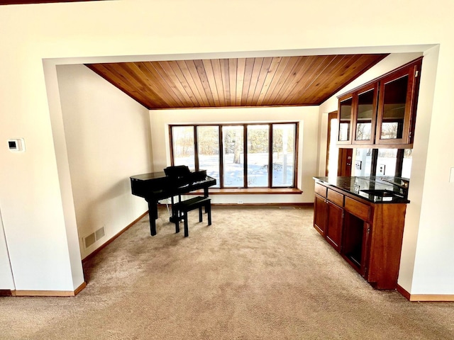 miscellaneous room with light colored carpet, wooden ceiling, and sink