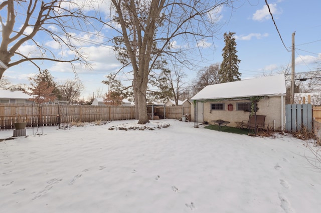 view of yard layered in snow