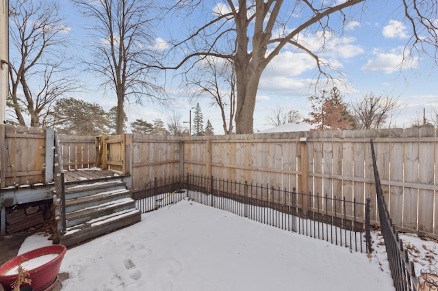 view of yard covered in snow