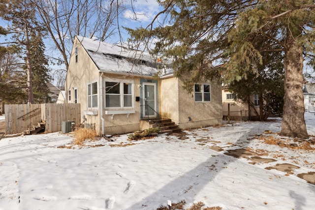 bungalow with central air condition unit