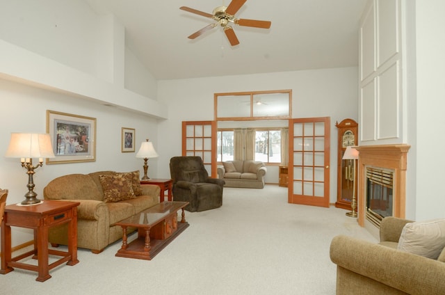 living room featuring french doors, carpet flooring, high vaulted ceiling, and ceiling fan