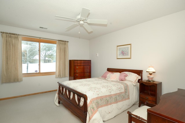 bedroom with ceiling fan and light colored carpet